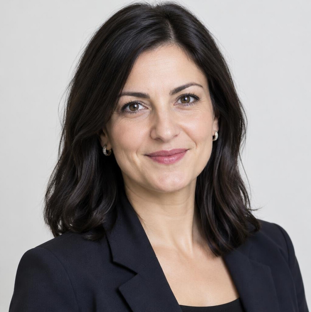 Portrait of a businesswoman with dark hair in a blazer